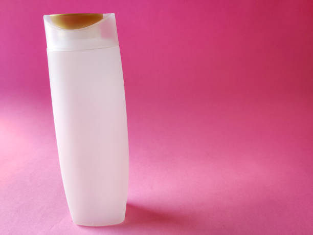 istock White color shampoo bottle isolated on pink background. Copyspace 1270451281