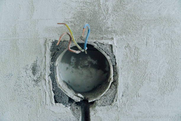 istock Holes in the concrete wall in the room for sockets 1270452006