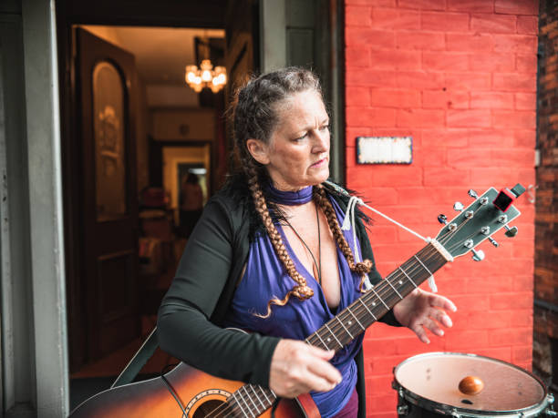 istock Woman playing acoustic guitar 1270452813