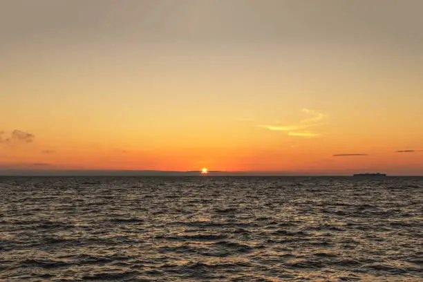 Photo of Gulf of Finland at sunset. Romantic evening. Summer