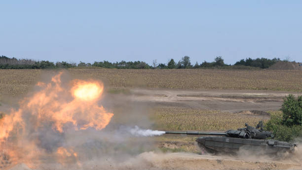 istock The tank fires a cannon and jumps from a springboard at the training ground 1270457528