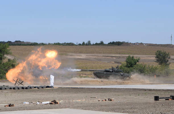 istock The tank fires a cannon and jumps from a springboard at the training ground 1270457561