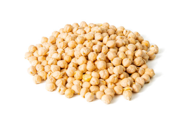 Dry raw organic chickpeas isolated on white background. Front views, close-up