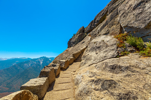 Stairway steps of the top of Moro Rock trail in summer in California, United States of America in Sequoia National Park.