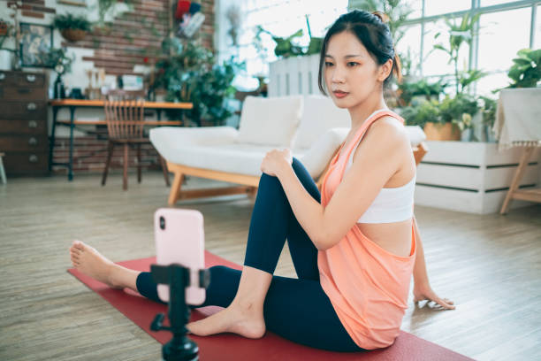 istock Young Woman Vlogging Exercise At Home 1270464236