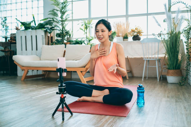 istock Young Woman Vlogging Exercise At Home 1270465443