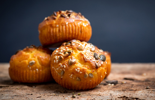Homemade salty muffin snacks with various seeds and sesame closeup