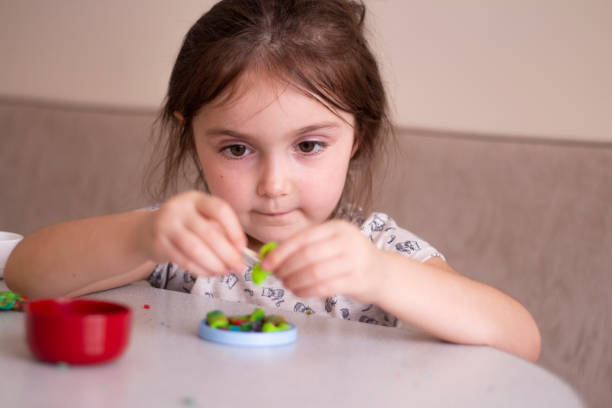 istock Little girl creating toys from playdough 1270469993