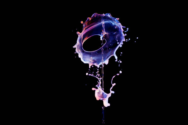 Falling drops of colored liquid, water splashes on a black background