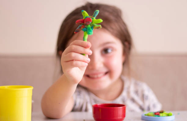 istock Little girl creating toys from playdough 1270470113