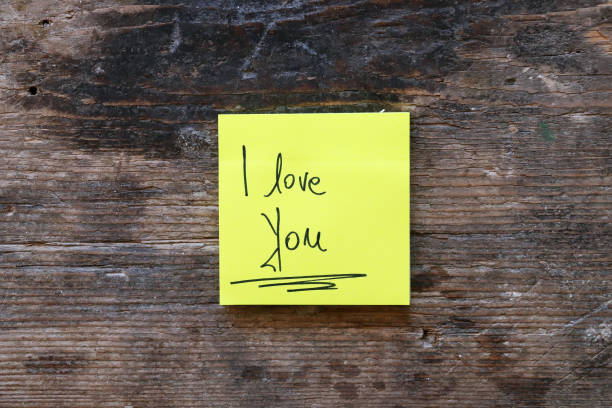 Message I LOVE YOU on wooden table