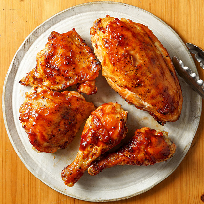 Barbecue chicken pieces on a plate