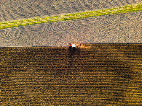 Tractor is plowing a field. Photograph from above