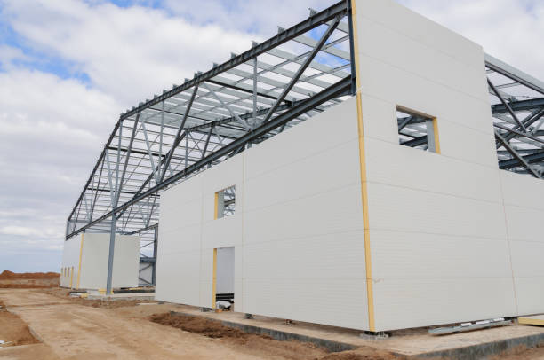 Construction of buildings made of steel structure and sandwich panels. The use of modern building materials Metal frame of the building with a sandwich panel of insulation on the wall. The use of modern building materials sandwich panel photos stock pictures, royalty-free photos & images
