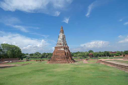 Old ruins of a temple in Phra Nakhon Si Ayutthaya province near Bangkok, Thailand. An old buddha statue in ancient temple. Famous tourist attraction landmark. History of Thai architecture.