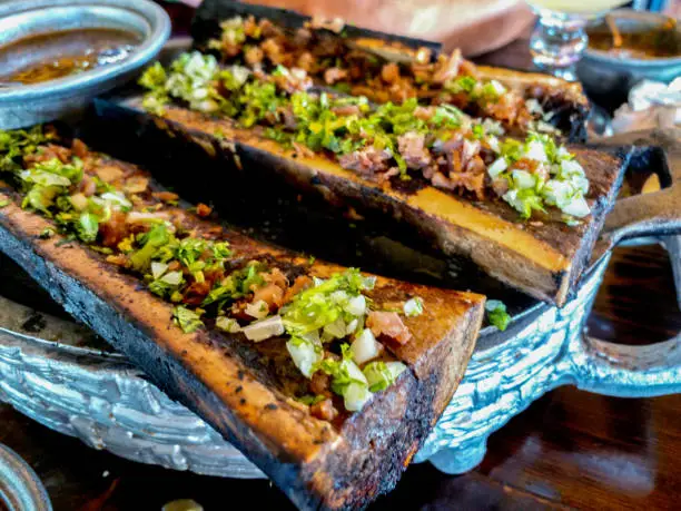 iPhone Image of Gourmet Mexican Grilled Bone Marrow topped with Mexican Spices and Cilantro