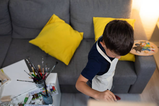 istock A boy engrossed in painting 1270476655