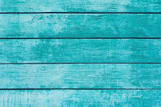 istock Turquoise shabby painted plank wall for background 1270477542