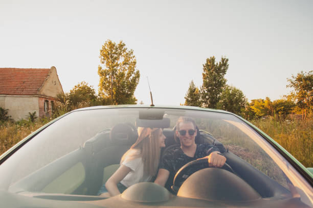 istock Happy couple enjoying in car travelling 1270481642