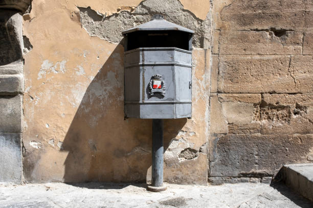 istock vintage black garbage can on a concrete wall background 1270481916