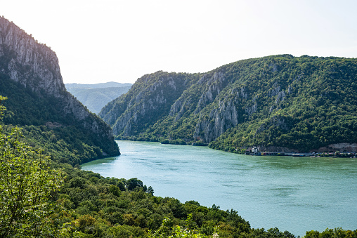 Danube river flowing through the amazing Djerdap gorge in Serbia. Beautiful coastline of second biggest river in Europe. One of very popular National parks and famous travel destination.