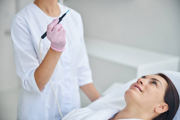 istock Pleased woman being treated by a professional dermatologist 1270488617