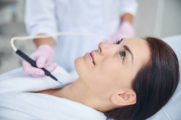 istock Pretty woman smiling during an electrosurgical procedure 1270488621