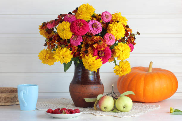 istock autumn still life with a bouquet and apples. 1270491449