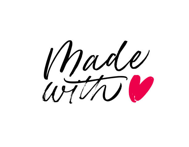 istock Made with love lettering for handcrafted goods. Hand drawn black brush calligraphy with heart symbol. 1270491613