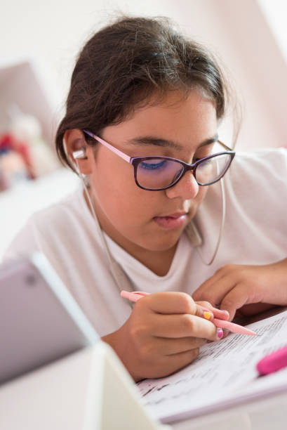 istock a girl is studying with tablet and talking teacher at home schooling and distence learning 1270491681