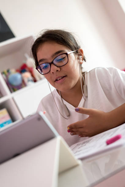 istock a girl is studying with tablet and talking teacher at home schooling and distence learning 1270491868