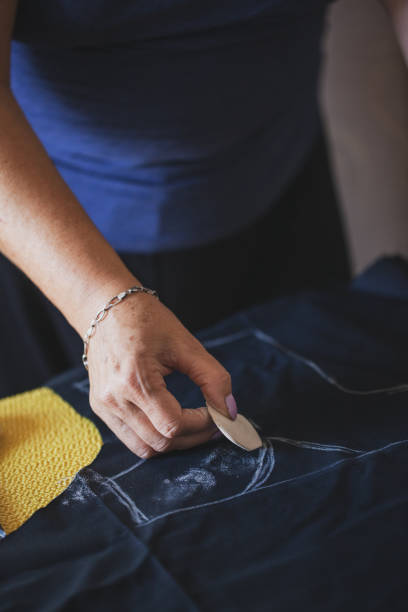 istock Tailor mature woman sewing at home 1270496339