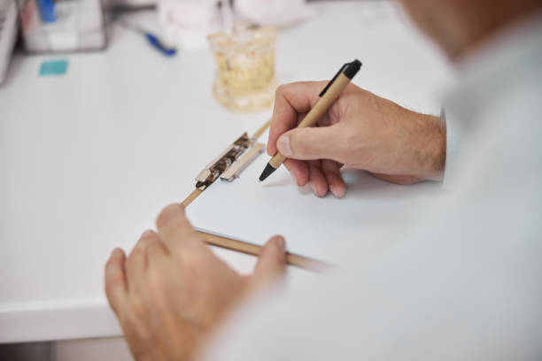 istock Medical worker writing on a sheet of paper 1270497141