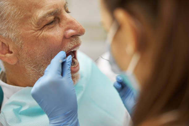 istock Senior man having a dental examination at a clinic 1270497157