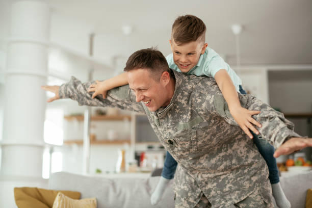 istock Soldier having fun with his son at home 1270497277