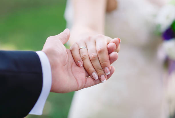 istock Bride and groom hands, close-up. Hand in hand 1270497648