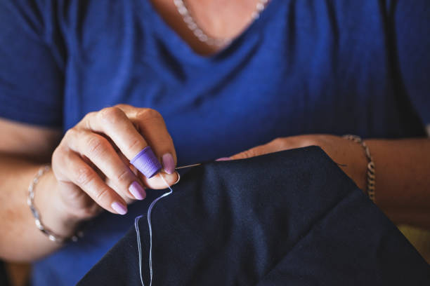 istock Tailor mature woman sewing at home 1270497700