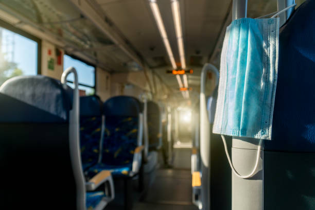 istock Empty inside train bus subway public transport with window view and blue seats people tourist new normal social distancing safe travel with hygiene face mask protect from covid corona virus 1270498475