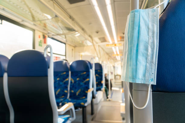 istock Empty inside train bus subway public transport with window view and blue seats people tourist new normal social distancing safe travel with hygiene face mask protect from covid corona virus 1270498569
