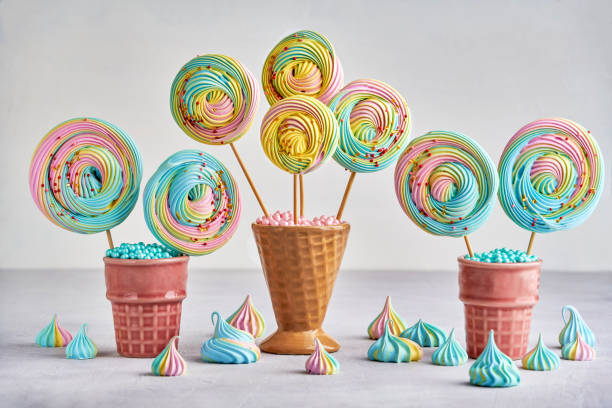 istock Colorful meringue lollipop in ceramic cone. Closeup with copy space 1270499738