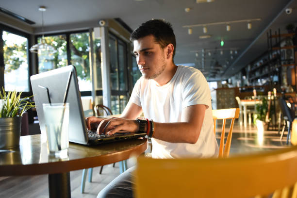 istock Young serious man working at coffee shop 1270502183