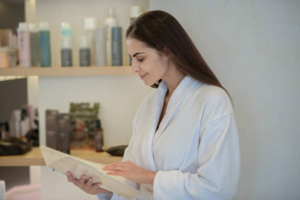 istock Woman in white robe choosing beauty procedure 1270503183
