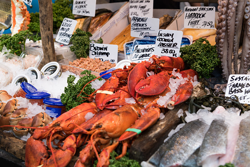 London, United Kingdom - march 20, 2019: Fresh seafood at the famous Borough Market late in the day. The market is Londons oldest open food market and draws thousands of travelers from around the world.
