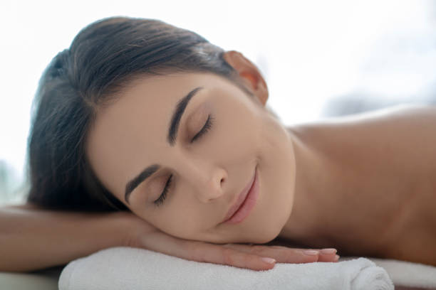 istock Dark-haired woman lying down after beauty procedures 1270503321