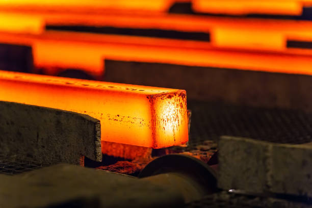istock Hot square steel bloom on the roll-table. 1270503924