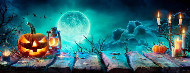 istock Jack O’ Lantern On Table In Spooky Night - Halloween With Full Moon 1270506298