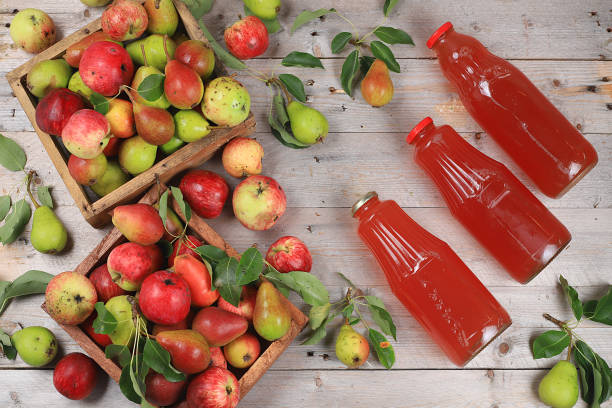 istock Apple and pear cider, juice, fruit drink and ingredients on a sunny table, home canning. The concept of diet and weight loss. Apples help cleanse the body. Healthy eating, 1270506547