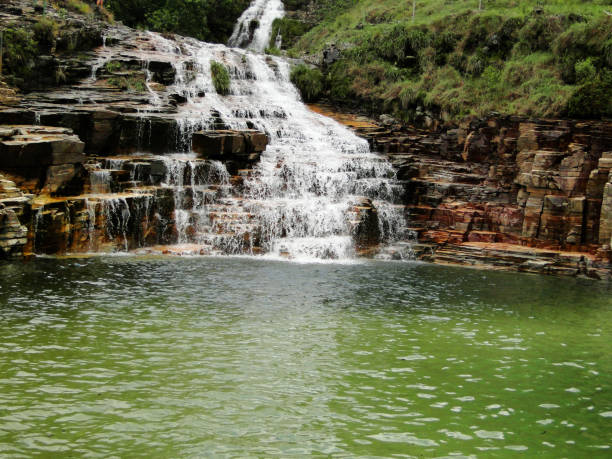 Waterfall green lake Waterfall gree lake at Paraiso Perdido (Lost Paradise) - Minas Gerais - Brazil capitolio stock pictures, royalty-free photos & images