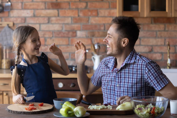 istock Excited young dad and daughter have fun cooking 1270508854