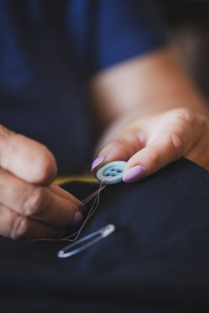 istock Tailor mature woman sewing at home 1270509017
